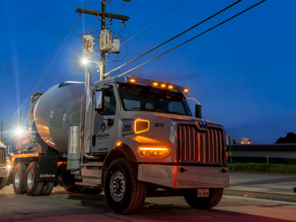 Cement mixer truck at night.