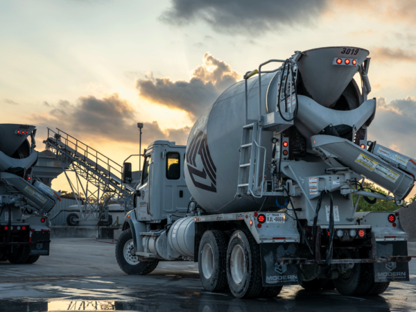 Cement mixer truck at sunset in the ready mix plant.